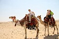 Riding camels by The Pyramids